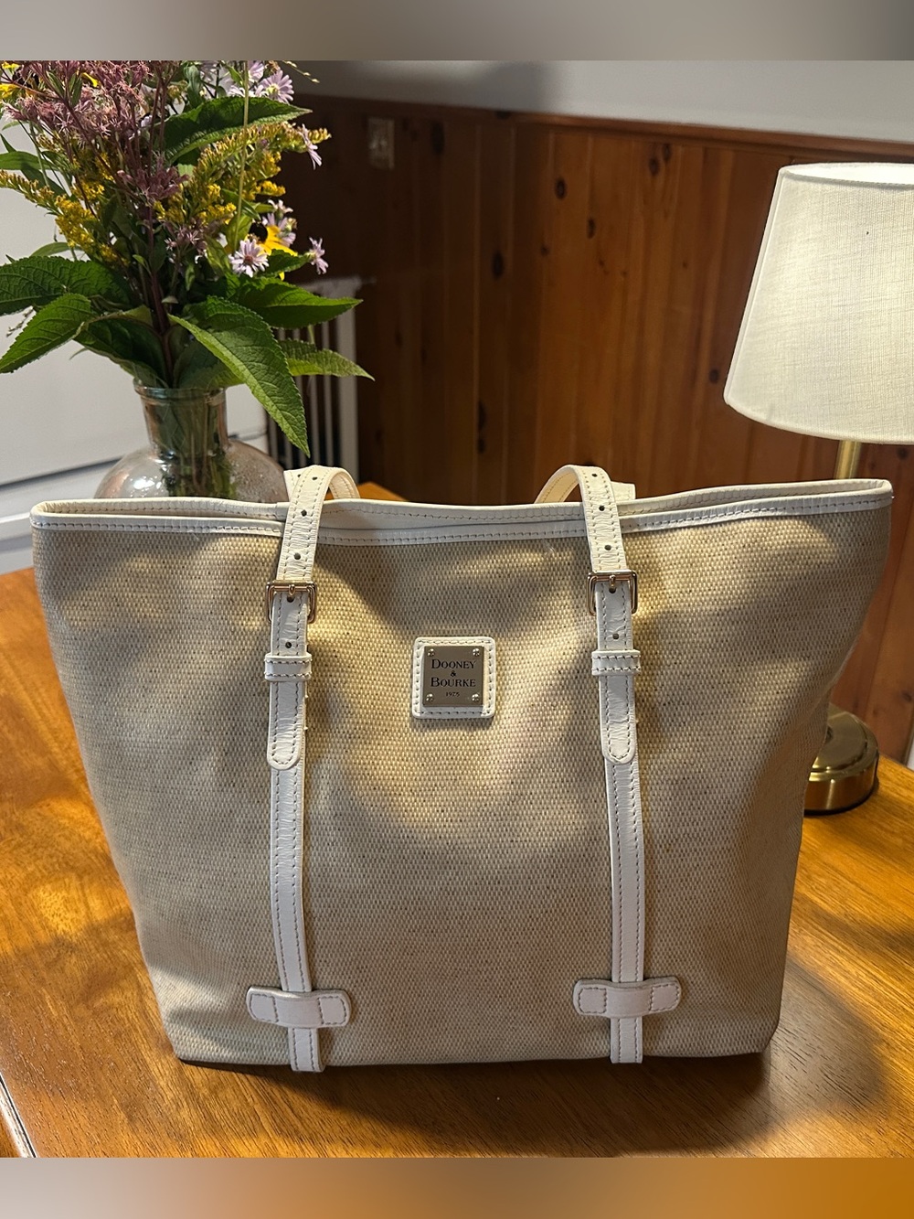 Dooney & Bourke Beige Tote with White Trim and Gold Plaque
